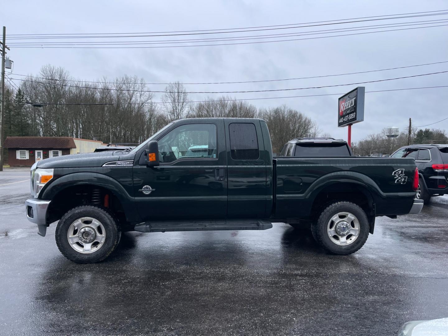 2015 Green /Gray Ford F-250 SD XLT SuperCab Long Bed 4WD (1FT7X2BT6FE) with an 6.7L V8 OHV 16V DIESEL engine, 6-Speed Automatic transmission, located at 547 E. Main St., Orwell, OH, 44076, (440) 437-5893, 41.535435, -80.847855 - Photo#16